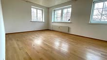 empty room, wooden floor, white walls, three windows, white ceiling, white radiator