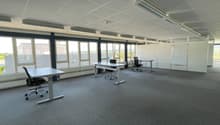 Large office space, 3 desks, 4 chairs, large windows, carpet floor