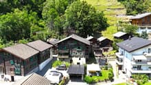 Mountain village, traditional wooden chalet, large garden, several buildings, panoramic views, solar panels, car parking