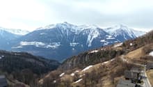 Mountains, trees, houses, road, snow