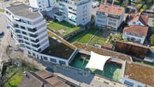 apartment building, office building, playground, car park, residential buildings, green roof