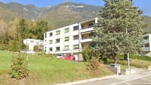 3 story building, balcony, view of the mountains
