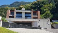 modern house, brick and glass, 2 floors, balcony, underground parking