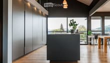 kitchen, island, plants, modern style, windows, grey cabinets, wooden floor, pendant lights