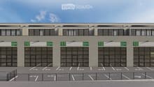 Industrial building with 4 parking spots in front, 4 doors labeled 10 to 13.