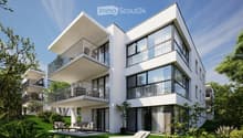 Modern, 2-story apartment building with large glass windows, balconies, and outdoor seating area