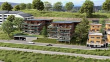 Apartment complex, wooden exterior, underground garage, covered parking, terraces, green surroundings