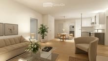 living room with couch, coffee table, armchair, dining area with table and chairs, kitchen with appliances