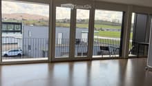 large windows, balcony, view of the outside, empty room