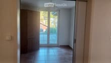 empty room, wooden cabinet, sliding glass door, balcony, tiled floor