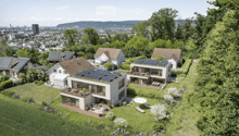 House. Aerial view of a modern residential complex with multiple houses, solar panels on roofs, spacious gardens, and outdoor seating areas.
