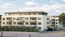 Modern two-story residential building with white facade, large windows, balconies, and a garage entrance.