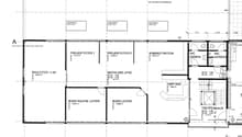 Floor plan of a multi-room office or administrative building, including project rooms, administration, reception, bathrooms, and a staircase.