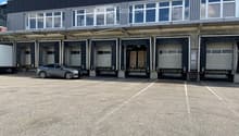 Warehouse with multiple loading docks and an exterior parking lot