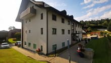 3 story house, white exterior, green shutters, balcony, garden, parking