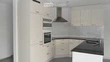 Modern kitchen with light-colored cabinets, stainless steel appliances, black countertops, and a built-in oven.