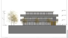 3 story building, multiple balconies, large windows, modern design