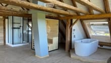 wooden beams, wooden floor, white bathtub, shower, sauna, wooden wall