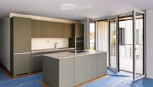 Modern kitchen with grey cabinets, central island, sink, and open sliding doors leading to a balcony.
