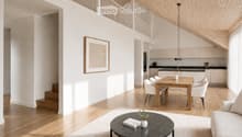 Open-concept living and dining area with light wood flooring, white walls, a modern sofa, coffee table, dining table with chairs, and a sleek kitchen area with cabinets and a sink.