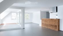 Modern, minimalist kitchen with a wooden counter, white walls, and large windows allowing natural light to fill the space.