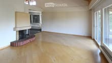 wooden floor, white walls, fireplace, glass doors, balcony