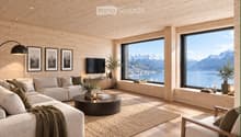 Modern living room with light wooden walls and ceiling, large windows offering a scenic mountain view, a sectional sofa, coffee table, armchair, floor lamp, television, side tables, vases, candles, and picture frames.