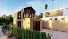 Modern two-story house with a contemporary design, featuring large windows, a flat roof, and a wooden facade. The house is surrounded by a well-maintained garden with shrubs and flowers, and there is a neighboring building visible in the background.