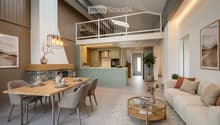 Modern open-plan living and dining area with a sofa, coffee table, dining table, and kitchen island. Features a fireplace, pendant light, and decorative vases with plants.