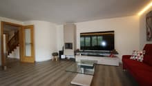 modern decor, living room, fireplace, red sofa, glass coffee table, TV, cabinet