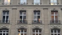 4 story building, multiple windows, balconies, ALDI Suisse store on the ground floor