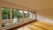 empty room, wooden floor, sliding glass doors, balcony, white walls, white ceiling