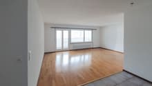 empty room, wooden floor, white walls, sliding glass doors, windows, radiator