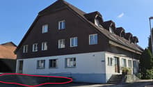 2 story house, brown roof, white walls, multiple windows, stairs, plants