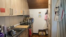 kitchen, wooden cabinets, countertops, gas stove, sink, dishwasher, kettle, chopping board, various cookware, cabinets on the wall