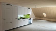 A kitchen with a white wooden ceiling, kitchen appliances, wooden panels on the walls, countertops, sinks and cabinets