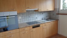light wood cabinets, gas stove, electric oven, sink, dishwasher, window