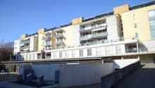 multiple story apartment building, balconies, yellow and white paint