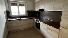 modern kitchen with wooden cabinets, tiled floor, sink, oven, dishwasher, window with blinds