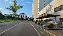 Empty road, building with bicycles parked outside