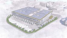 Logistics building with solar panels on the roof, multiple parking spaces for trucks