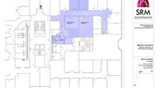 Commercial building floor plan with common areas, meeting rooms, and shared facilities.