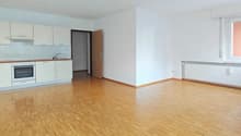 empty room, white walls, hardwood floors, white kitchen cabinets, sink, oven