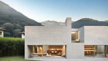 modern architectural design, made of white stone, large windows, large garden, mountains in the background
