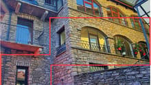 stone building, multiple floors, balconies, arched windows, staircase, wall, metal railings