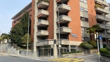 residential building with balconies, orange exterior, modern architecture