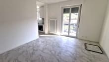 Empty room, marble flooring, white walls, sliding glass door, balcony