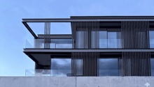modern design, glass walls, balcony, raised ground floor