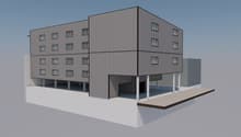 Three-story building, multiple windows, garage at base