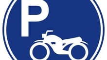 Blue sign with the letter P and an image of a motorcycle